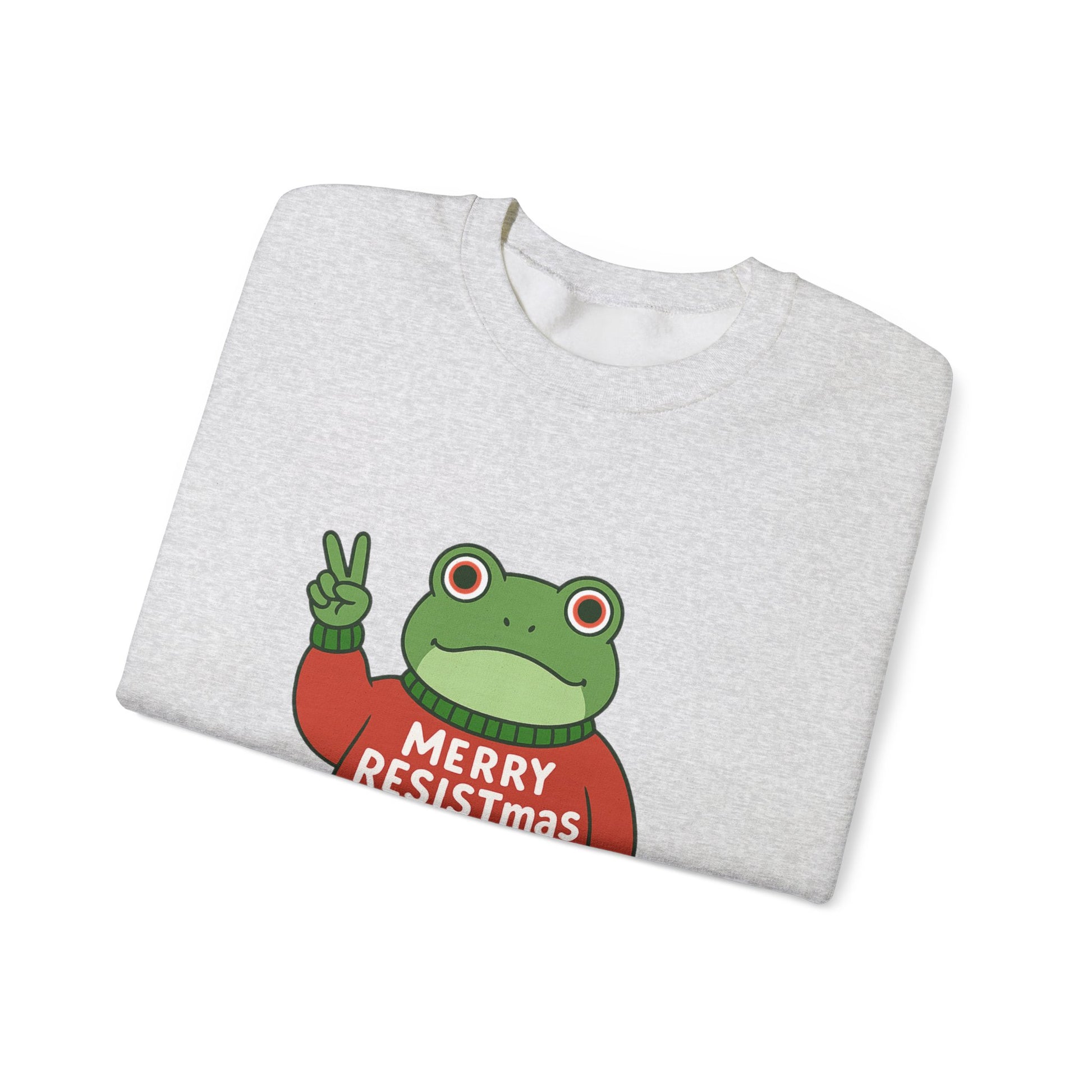 Folded light gray sweatshirt with the Portland protest frog wearing a sweater displaying 'Merry Resistmas' by empowHERbyHeidi