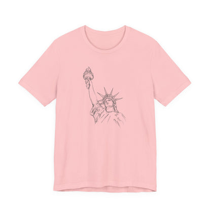 Pink t-shirt with a graphic of the Statue of Liberty by empowHER by Heidi