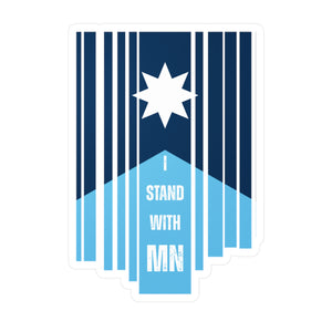 Blue and white sticker with a Minnesota flag and text "I Stand with MN" by empowHER by Heidi