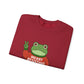 Folded red sweatshirt with the Portland protest frog wearing a sweater displaying 'Merry Resistmas' by empowHERbyHeidi