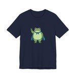 Navy t-shirt with a bold graphic of the Portland protest frog—red eyes, blue cape, and unimpressed face by empowHERbyHeidi