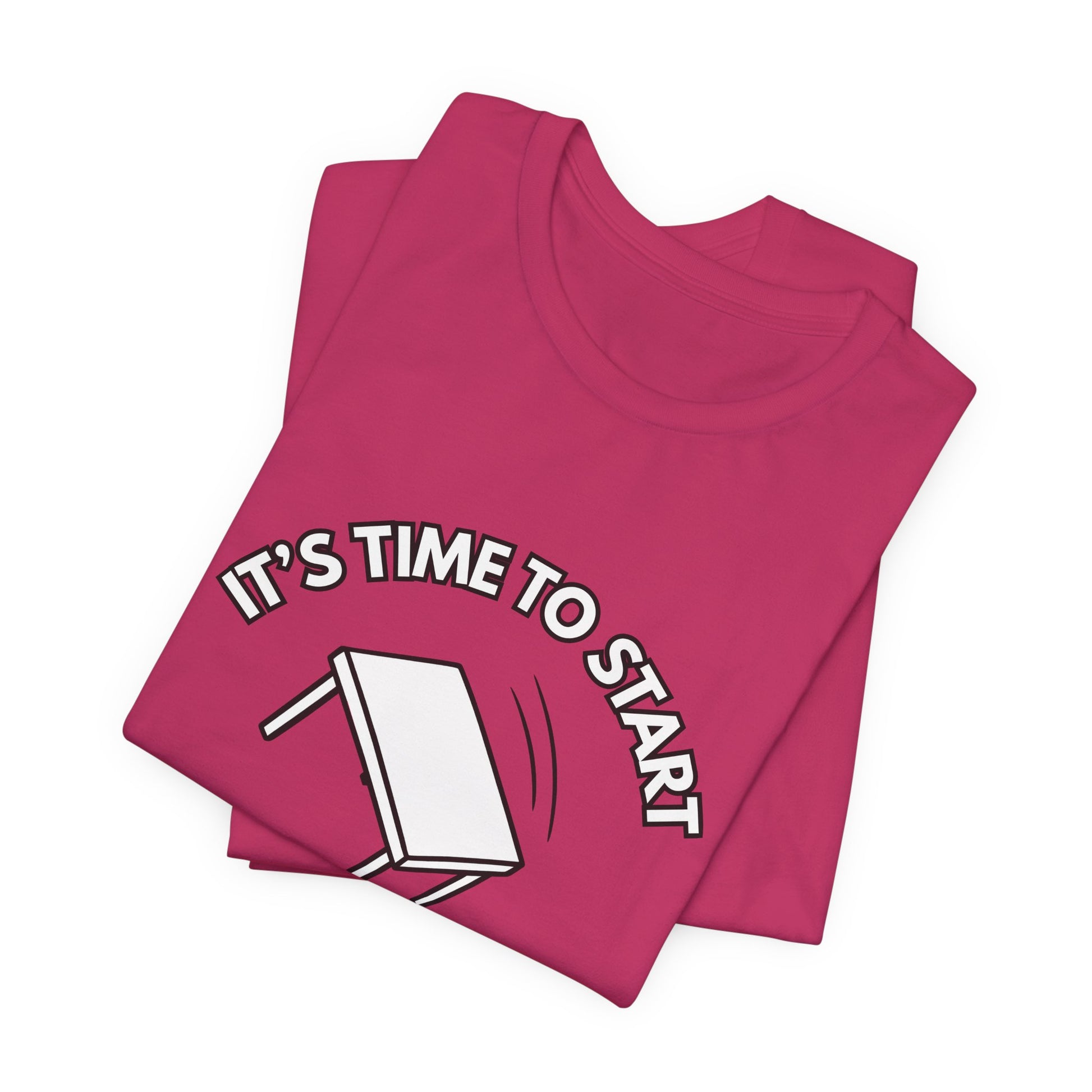 Folded pink t-shirt with a flipping table graphic and text "It's time to start" by empowHER by Heidi