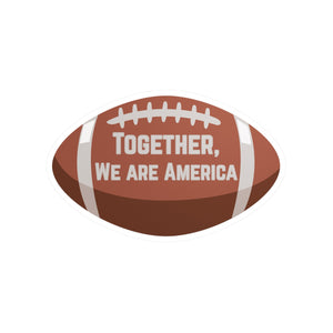 Football-shaped sticker with 'Together, We Are America' text from the Super Bowl Half-time show with Bad Bunny