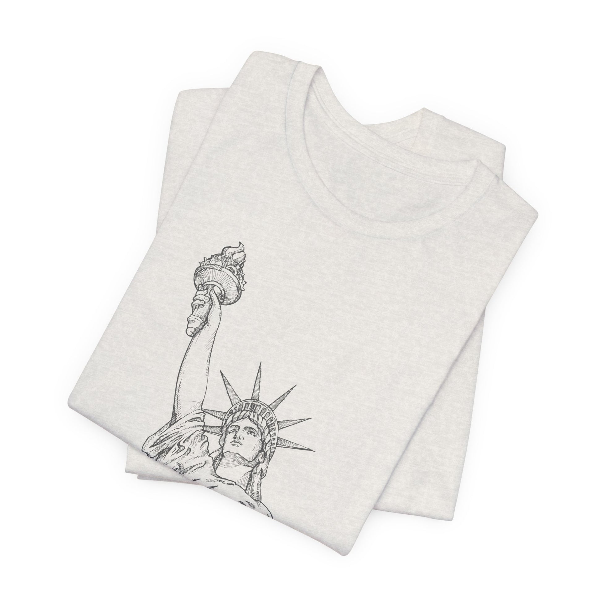 folded white t-shirt with Statue of Liberty design by empowHER by Heidi