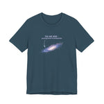Dark blue t-shirt with graphic of the Milky Way galaxy with an arrow pointing to it and text that says "YOU ARE HERE - Paying taxes to pedophiles" by empowHER by Heidi