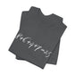 Folded gray t-shirt with the mathematical equation "8+6+4+7=25" written in chalk like text by empowHER by Heidi