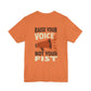 Orange t-shirt with motivational message 'Raise Your Voice Not Your Fist' – empowHER by Heidi political protest apparel