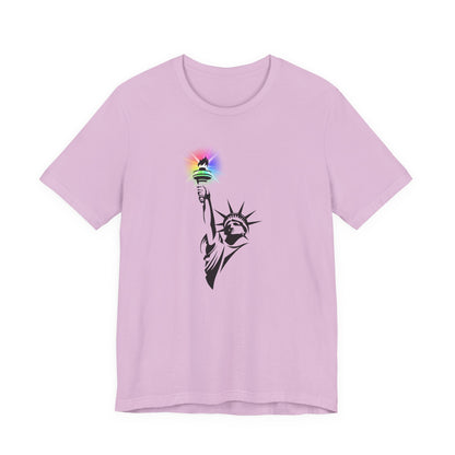 Lilac t-shirt with the Statue of Liberty and rainbow Pride colors emitting from her torch by empowHER by Heidi