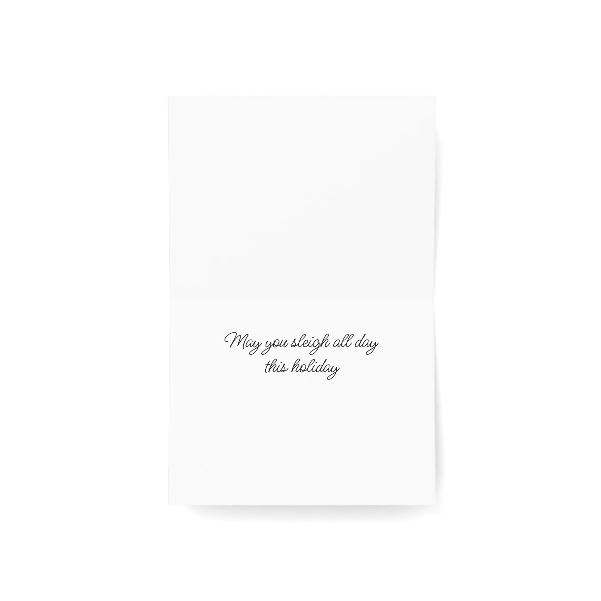 Inside of a white card with black text 'May you sleigh all day this holiday' on a white background