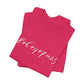 Folded hot pink t-shirt with the mathematical equation "8+6+4+7=25" written in chalk like text by empowHER by Heidi