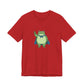 Red t-shirt with a bold graphic of the Portland protest frog—red eyes, blue cape, and unimpressed face by empowHERbyHeidi