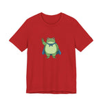 Red t-shirt with a bold graphic of the Portland protest frog—red eyes, blue cape, and unimpressed face by empowHERbyHeidi
