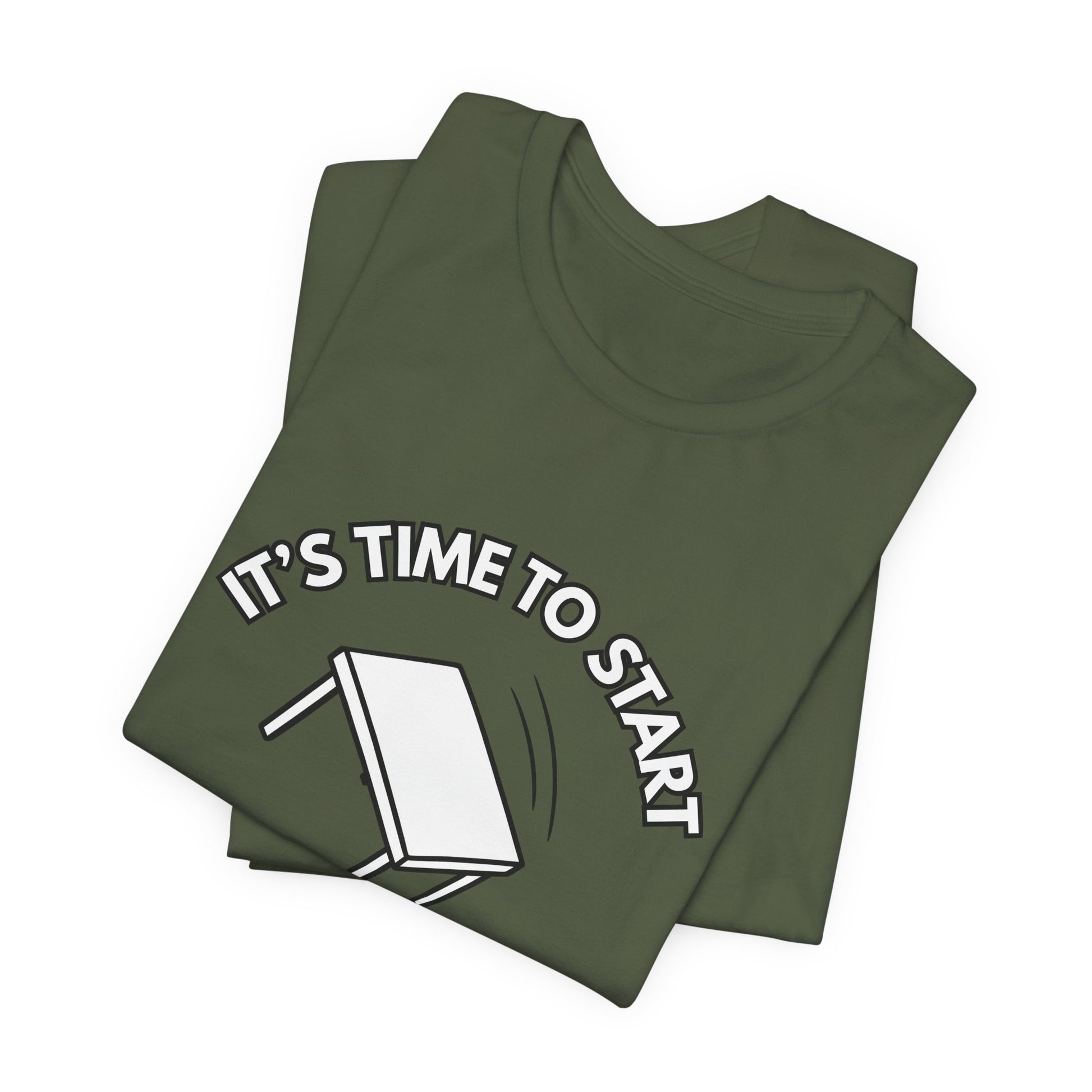 Folded military green t-shirt with a flipping table graphic and text "It's time to start" by empowHER by Heidi