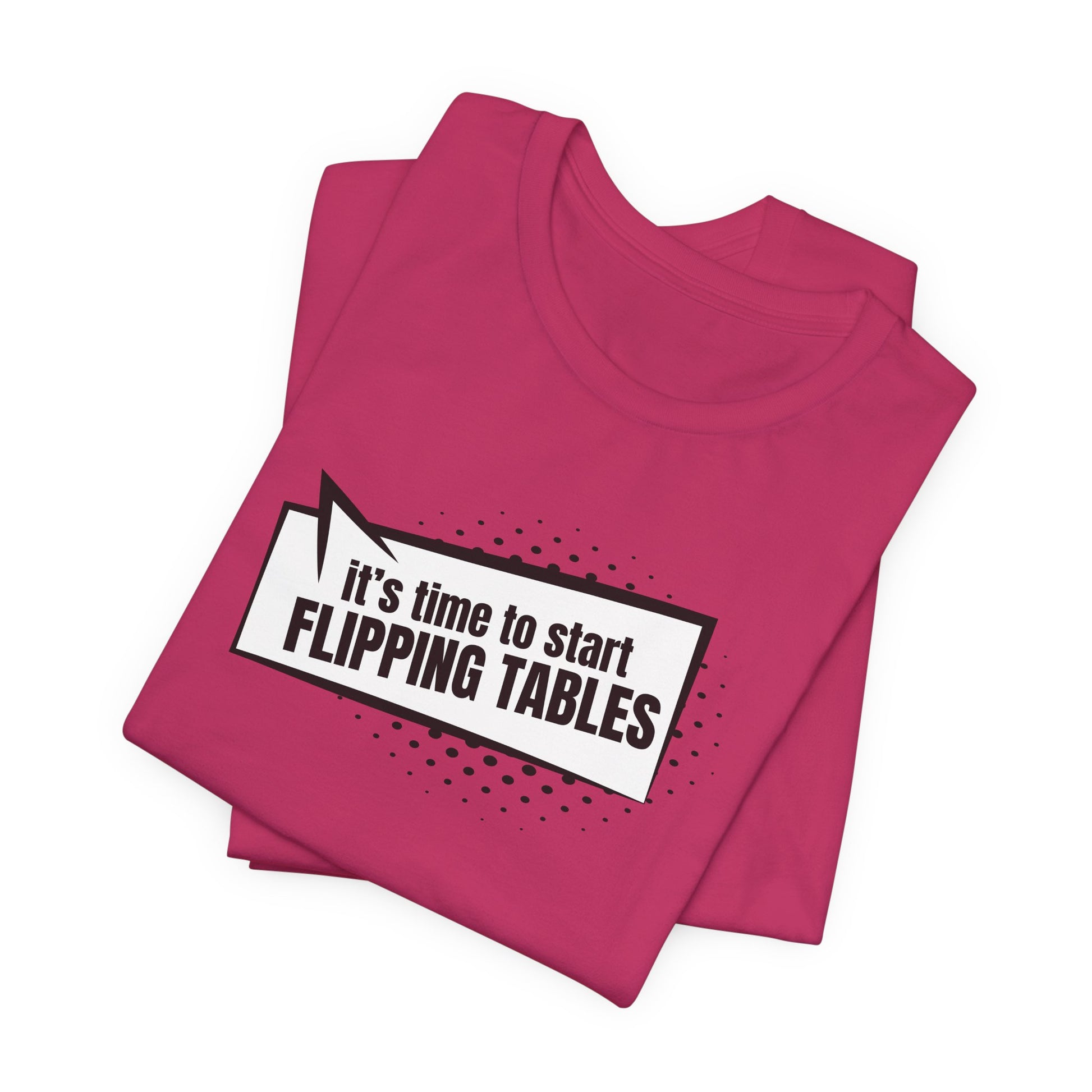 Folded pink t-shirt with cartoon speech bubble with text "It's Time to Start Flipping Tables" by empowHER by Heidi