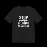 Black t-shirt with white text 'STOP Alligator Alcatraz' on a black background
