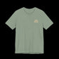 Green t-shirt with small text on left chest that says "Stop Protecting Predators"