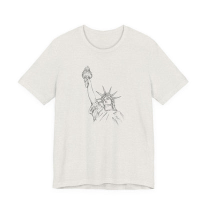 White t-shirt with a graphic of the Statue of Liberty by empowHER by Heidi