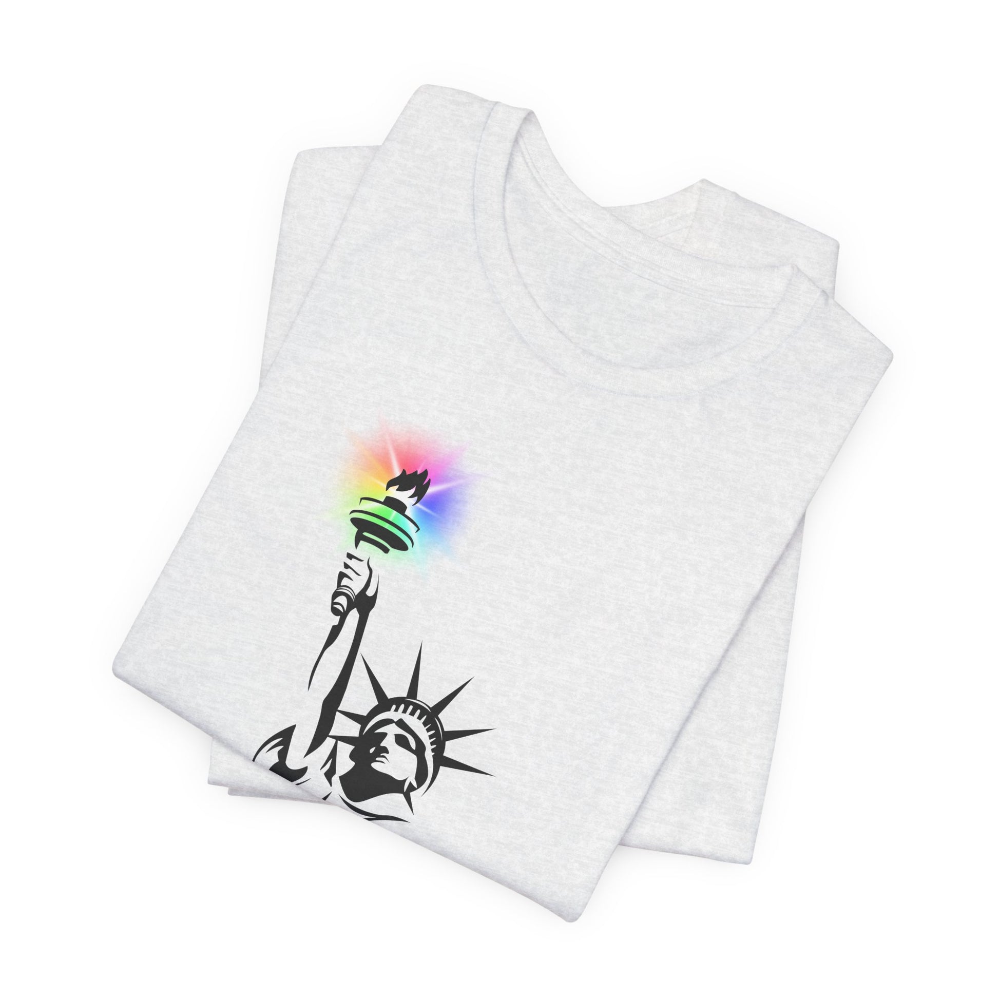 Folded ash gray t-shirt with the Statue of Liberty and rainbow Pride colors emitting from her torch by empowHER by Heidi
