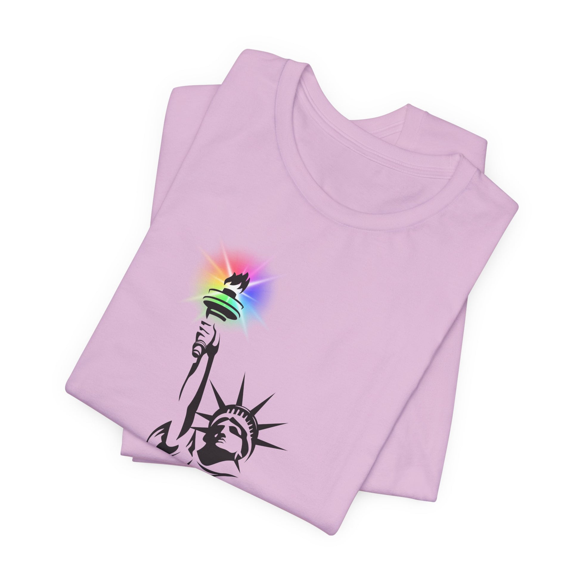 Folded lilac t-shirt with the Statue of Liberty and rainbow Pride colors emitting from her torch by empowHER by Heidi