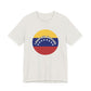 White t-shirt with a circular design featuring the Venezuelan flag and 'I stand with Venezuela' text by empowHER by Heidi