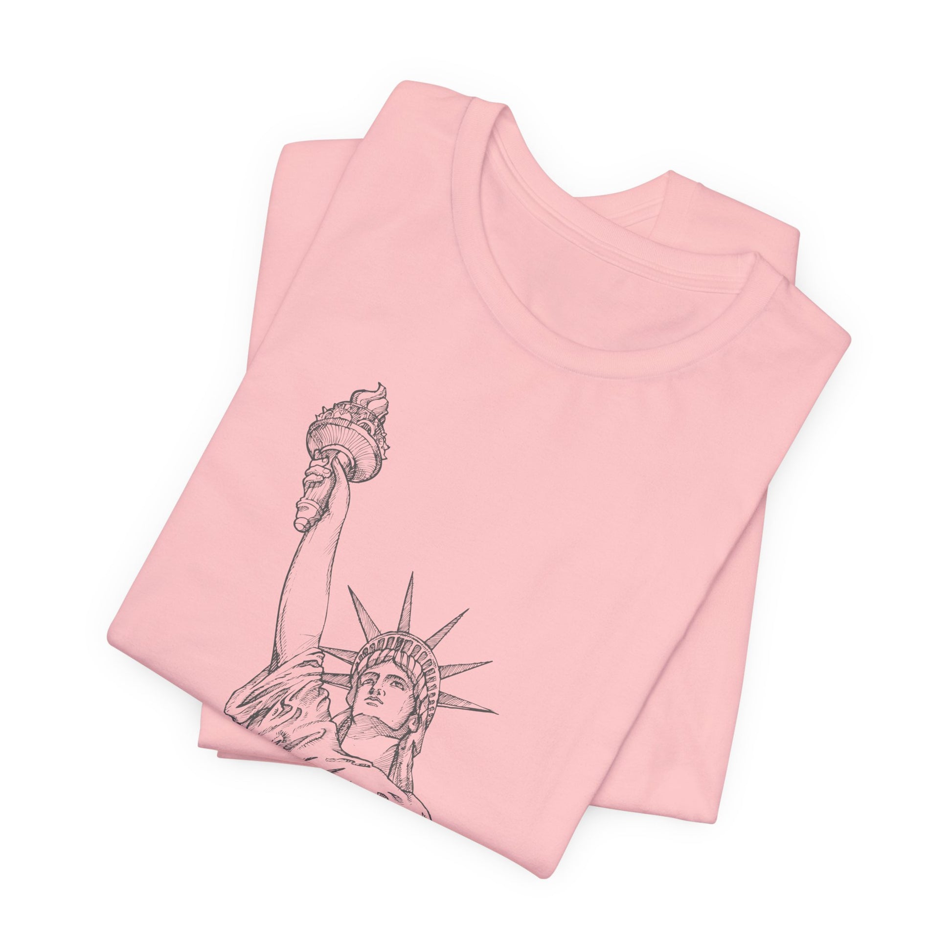 Folded pink t-shirt with Statue of Liberty design by empowHER by Heidi