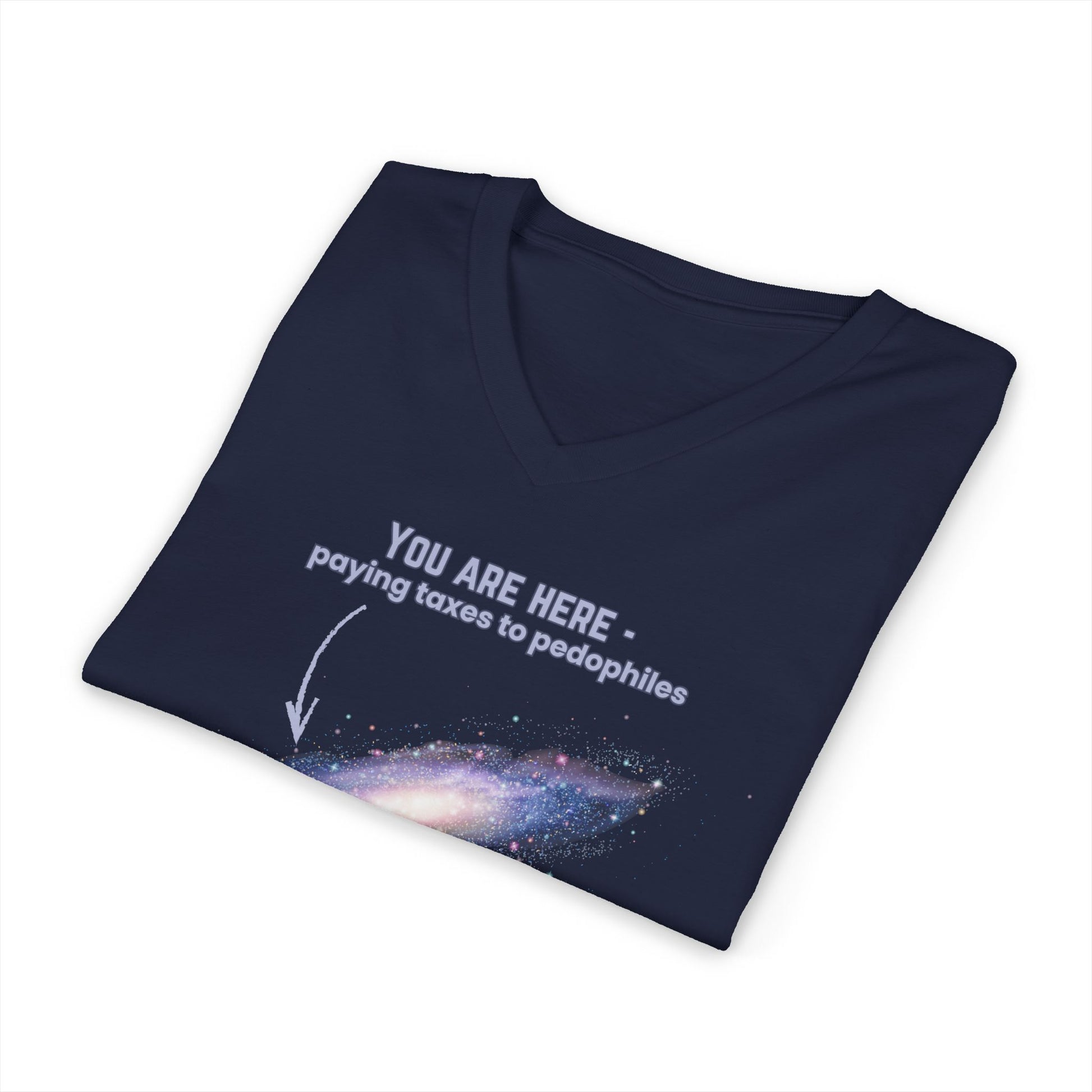 Folded purple v-neck t-shirt with graphic of the Milky Way galaxy with an arrow pointing to it and text that says "YOU ARE HERE - Paying taxes to pedophiles" by empowHER by Heidi