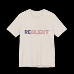 Beige t-shirt with 'RESILIENT' text in red, white, and blue American Flag letters on a plain background