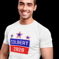 Man wearing a white t-shirt with 'Colbert 2028' design on a black background