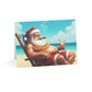 Card with a cartoon Santa Claus lounging on a beach, smoking a cigar and holding a drink.
