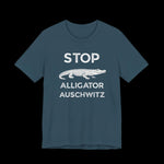 Dark teal t-shirt with white text that says "STOP ALLIGATOR AUSCHW*TZ" with alligator graphic on a black background