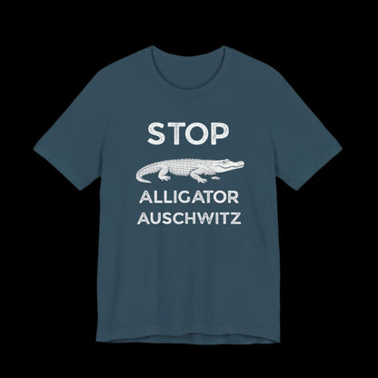 Dark teal t-shirt with white text that says "STOP ALLIGATOR AUSCHW*TZ" with alligator graphic on a black background