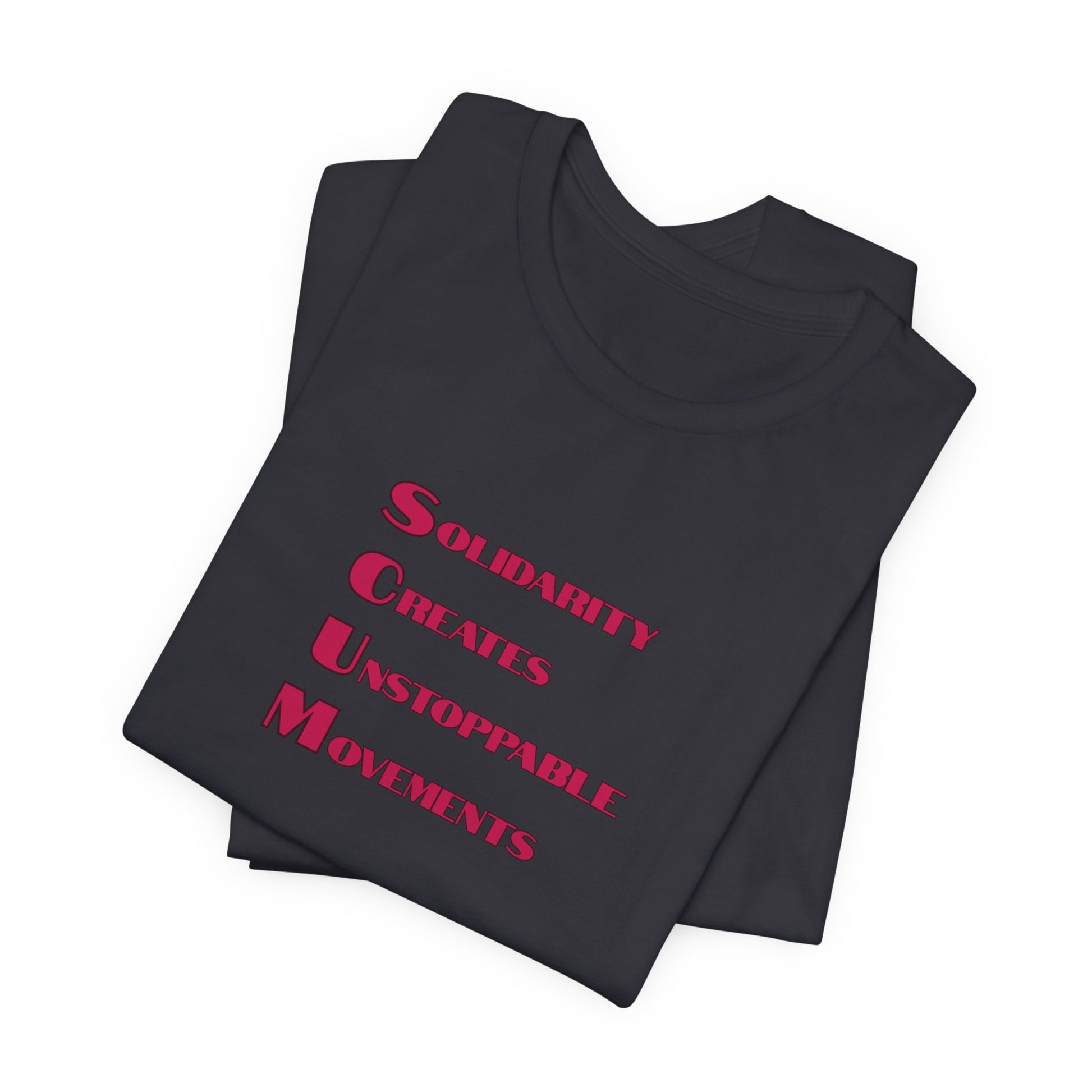 Folded black t-shirt with blue text 'Solidarity Creates Unstoppable Movements' by empowHER by Heidi