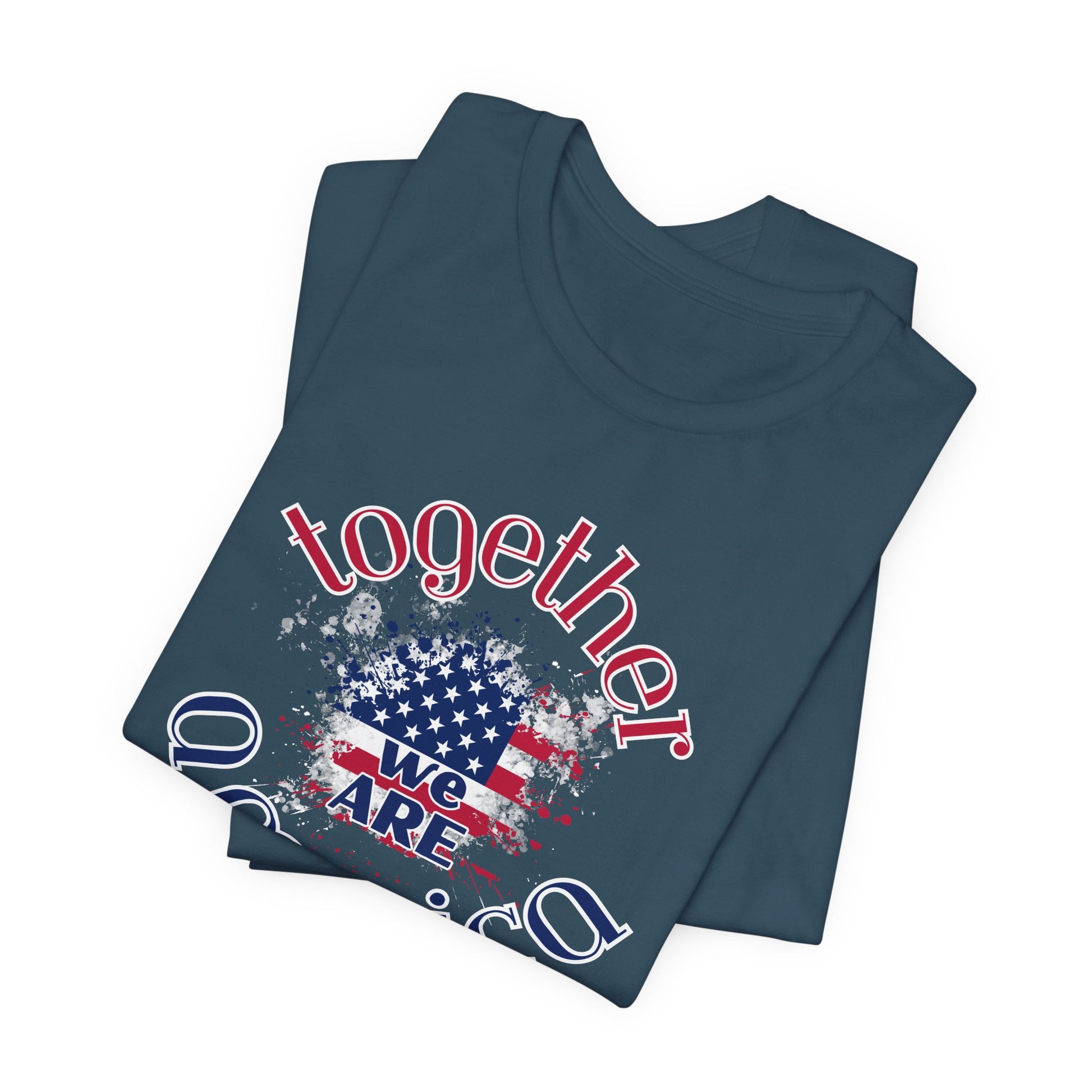 Folded teal t-shirt with 'Together We Are America' graphic design on a white background