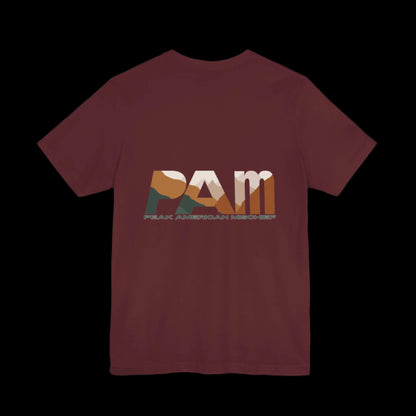 Maroon  t-shirt with 'PAM' logo "Peak American Mischief" on the back against a black background