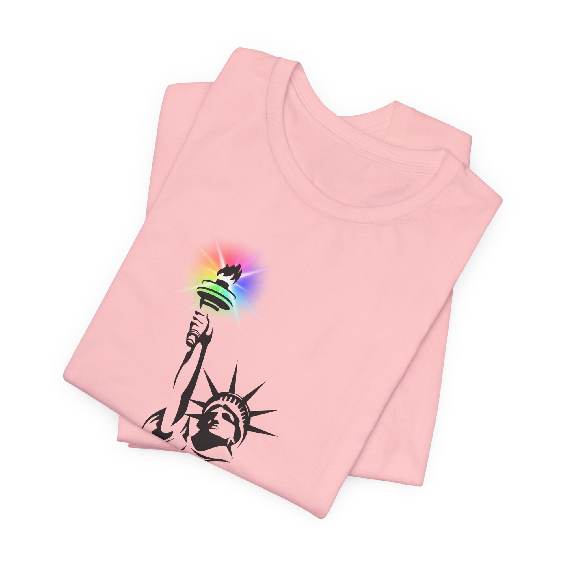 Folded pink t-shirt with the Statue of Liberty and rainbow Pride colors emitting from her torch by empowHER by Heidi