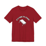 Red t-shirt with a flipping table graphic and text "It's time to start" by empowHER by Heidi