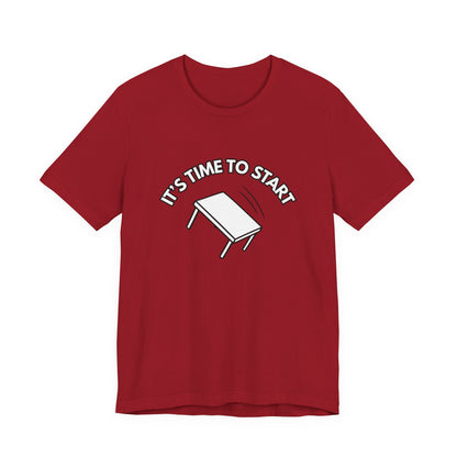 Red t-shirt with a flipping table graphic and text "It's time to start" by empowHER by Heidi