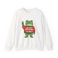 White sweatshirt with the Portland protest frog wearing a sweater displaying 'Merry Resistmas' by empowHERbyHeidi