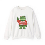 White sweatshirt with the Portland protest frog wearing a sweater displaying 'Merry Resistmas' by empowHERbyHeidi
