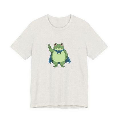 Heather cement t-shirt with a bold graphic of the Portland protest frog—red eyes, blue cape, and unimpressed face by empowHERbyHeidi