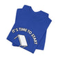 Folded blue t-shirt with a flipping table graphic and text "It's time to start" by empowHER by Heidi