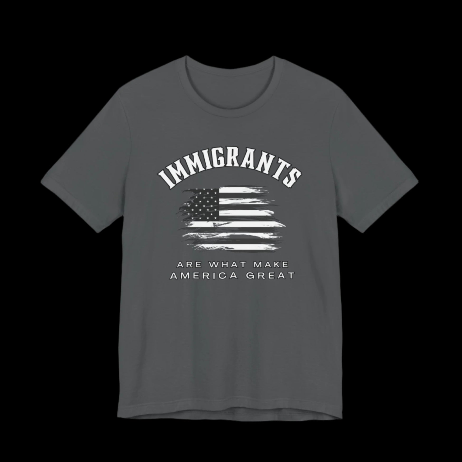 Gray t-shirt with American flag graphic and text that says "Immigrants are what make America Great" on a black background