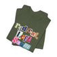 Folded green t-shirt with colorful text "radical left scum" design by empowHER by Heidi