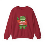 Red sweatshirt with the Portland protest frog wearing a sweater displaying 'Merry Resistmas' by empowHERbyHeidi