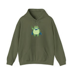 Military green fleece hoodie with a bold graphic of the Portland protest frog—red eyes, blue cape, and unimpressed face by empowHERbyHeidi
