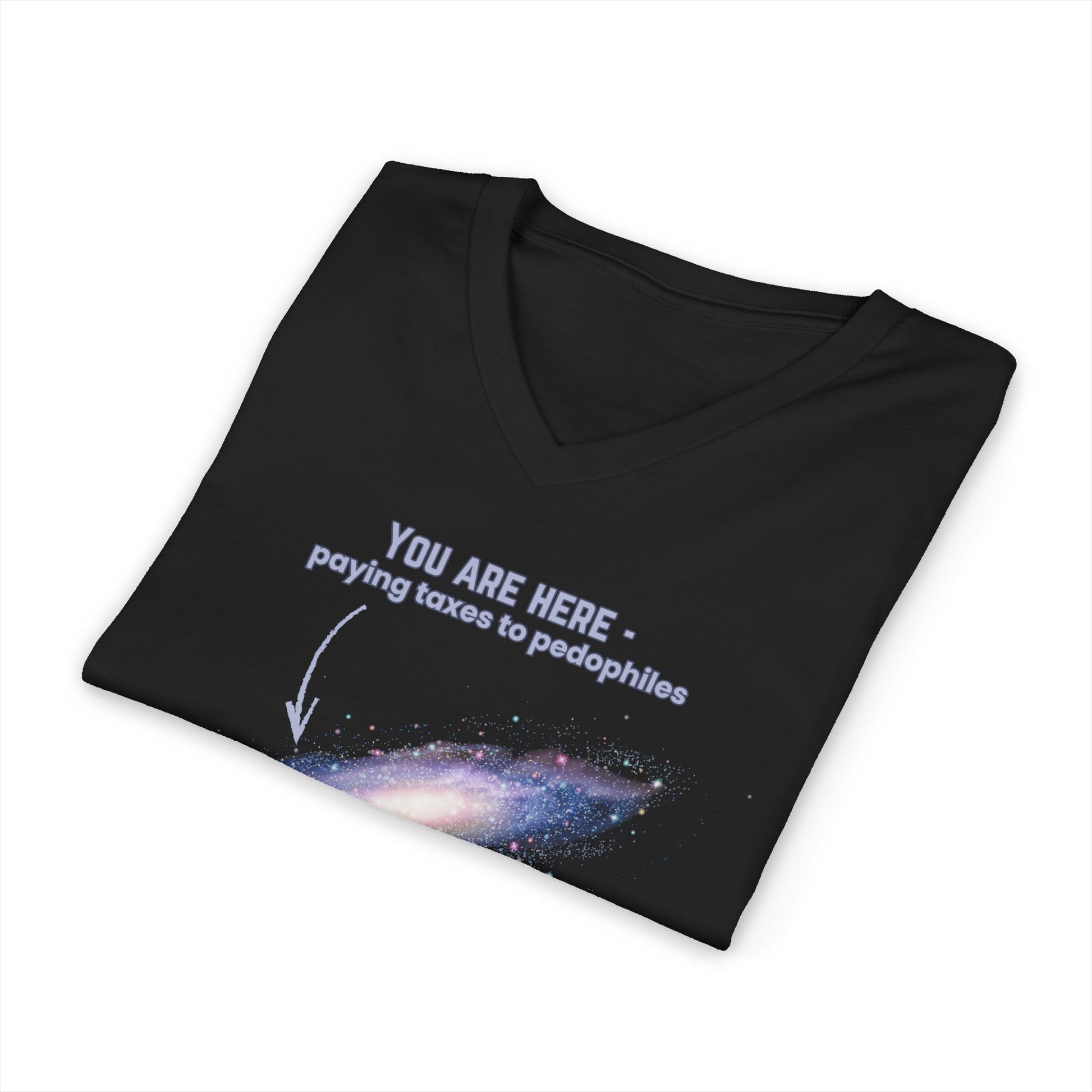 Folded black v-neck t-shirt with graphic of the Milky Way galaxy with an arrow pointing to it and text that says "YOU ARE HERE - Paying taxes to pedophiles" by empowHER by Heidi