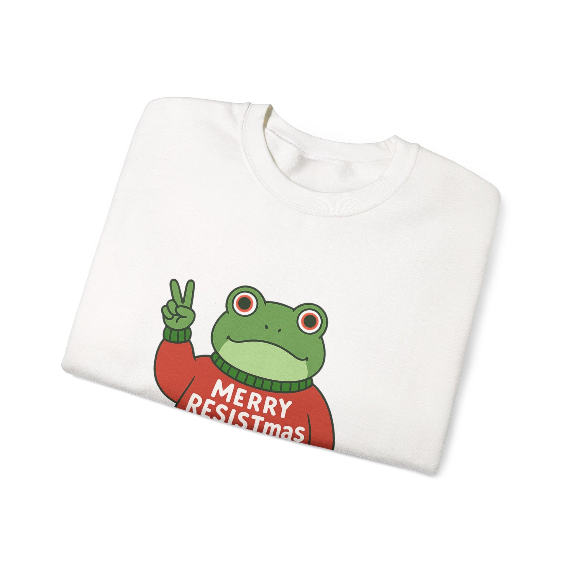 Folded white sweatshirt with the Portland protest frog wearing a sweater displaying 'Merry Resistmas' by empowHERbyHeidi