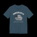 Deep teal t-shirt with American flag graphic and text that says "Immigrants are what make America Great" on a black background