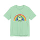 Light green t-shirt with the Portland protest frog and Pride rainbow design by empowHER by Heidi