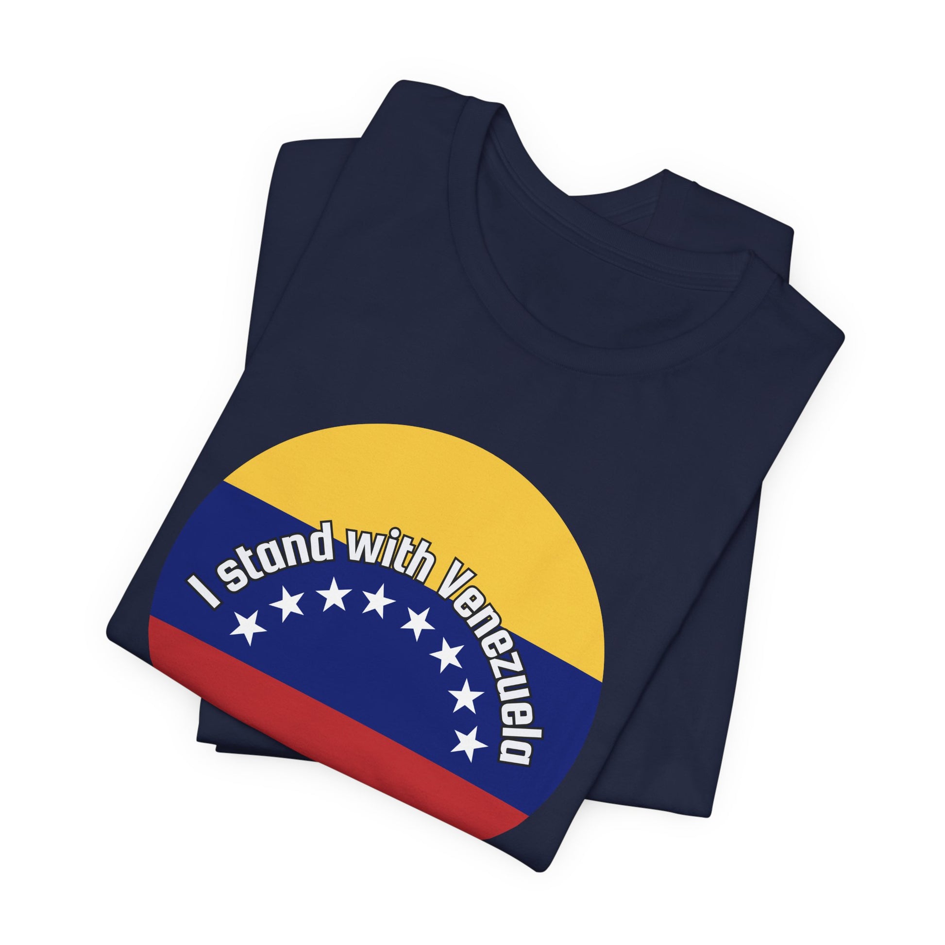 Folded navy blue t-shirt with a circular design featuring the Venezuelan flag and 'I stand with Venezuela' text by empowHER by Heidi
